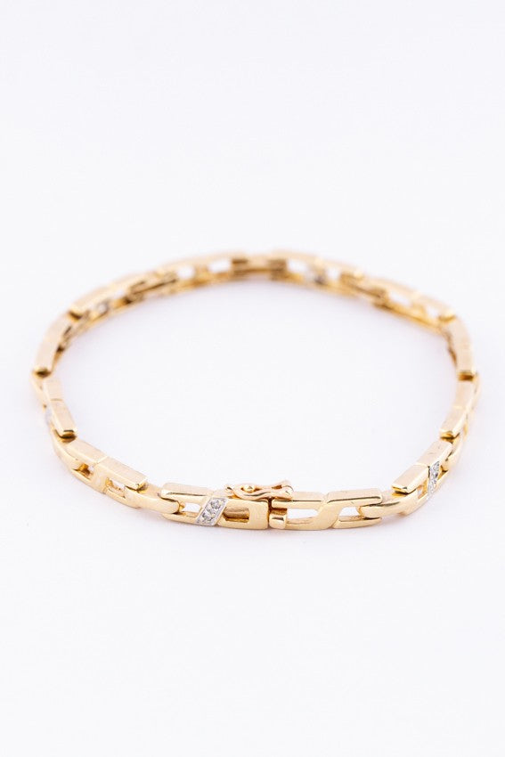 Gouden schakel armband met briljanten.