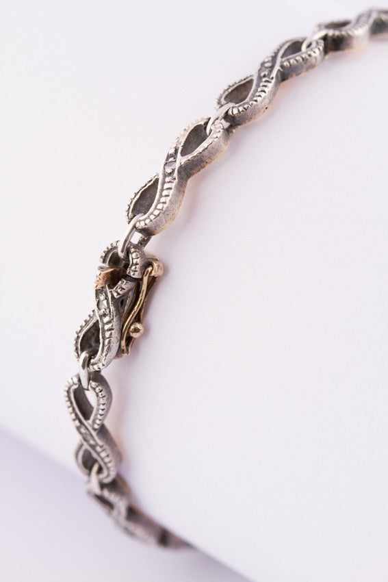 Gold/silver link bracelet with rose-cut diamonds.