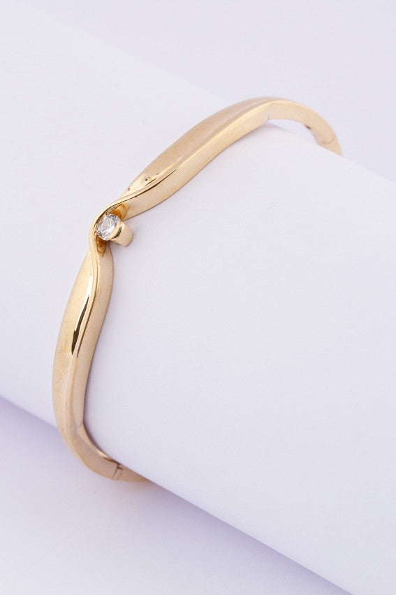 Gouden slaven armband met een briljant