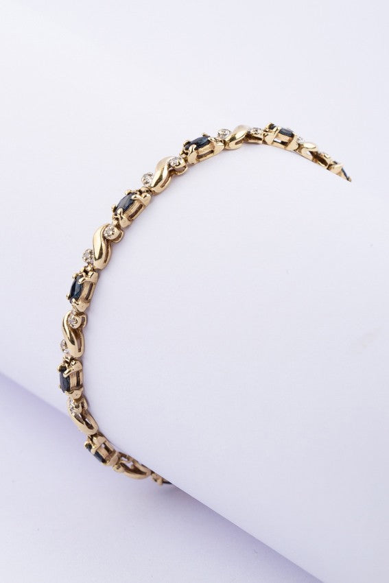 Gold link bracelet with sapphire and diamond