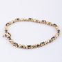 Gold link bracelet with sapphire and diamond