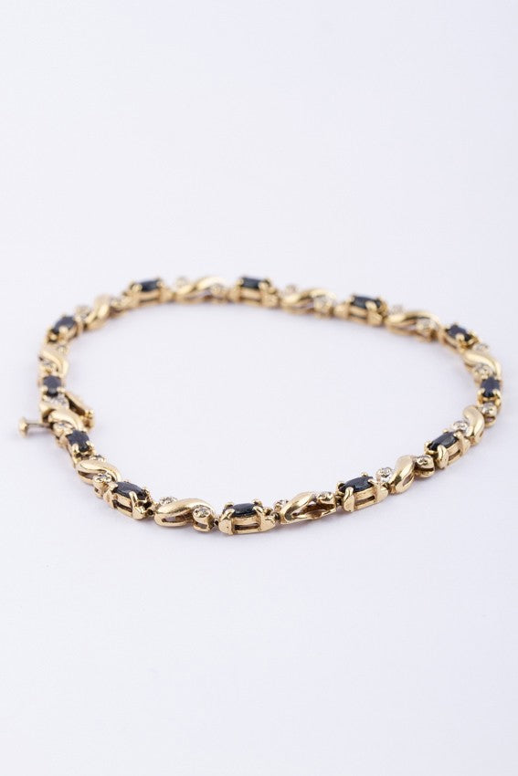 Gold link bracelet with sapphire and diamond