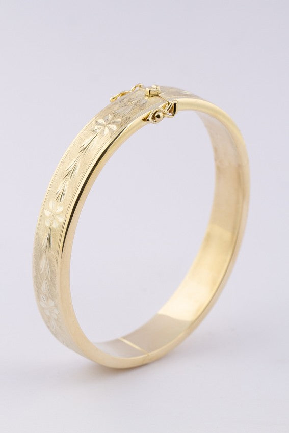 Gold engraved slave bracelet with hinge closure