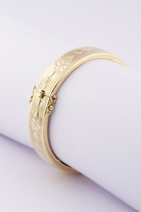 Gold engraved slave bracelet with hinge closure