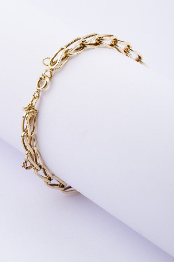 Gold link bracelet with safety chain