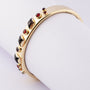 Gold slave bracelet and garnets