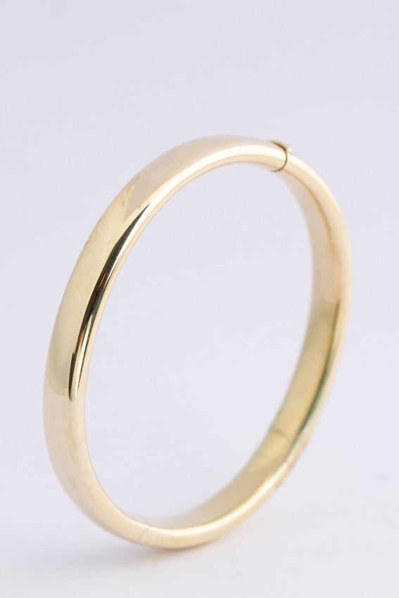 Gold slave bracelet with hinged closure