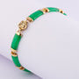 Gold link bracelet with jade