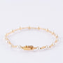 Gouden schakelarmband met parels