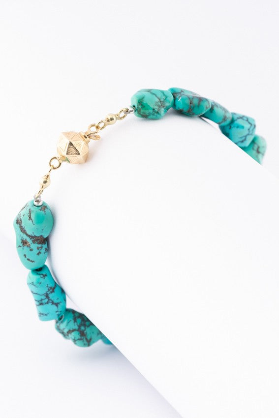 Turquoise bracelet with gold clasp