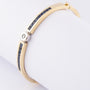 White/yellow gold slave bracelet with brilliant and square cut sapphire