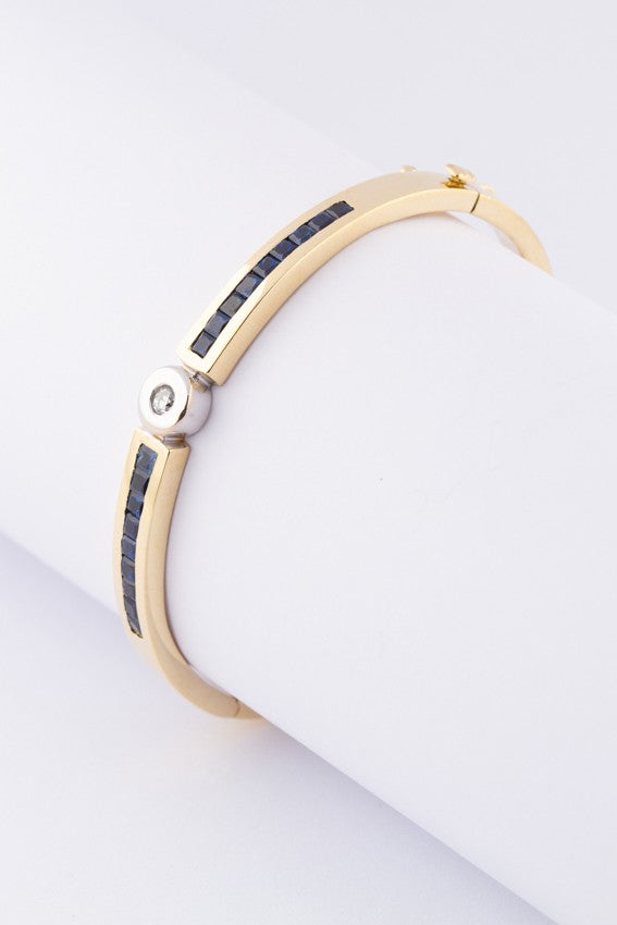 White/yellow gold slave bracelet with brilliant and square cut sapphire
