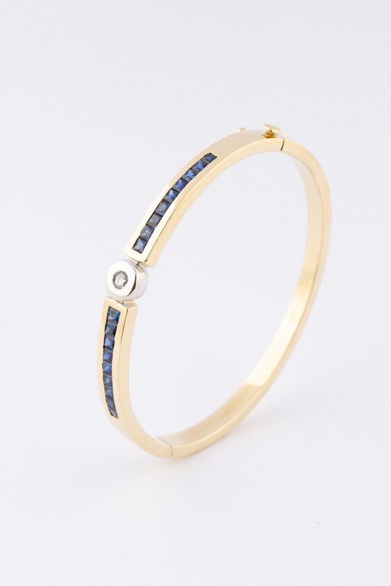 White/yellow gold slave bracelet with brilliant and square cut sapphire