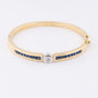 White/yellow gold slave bracelet with brilliant and square cut sapphire