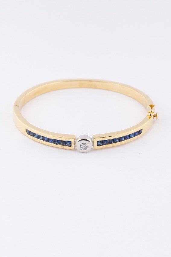 White/yellow gold slave bracelet with brilliant and square cut sapphire
