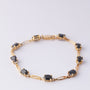 Gold link bracelet with sapphires