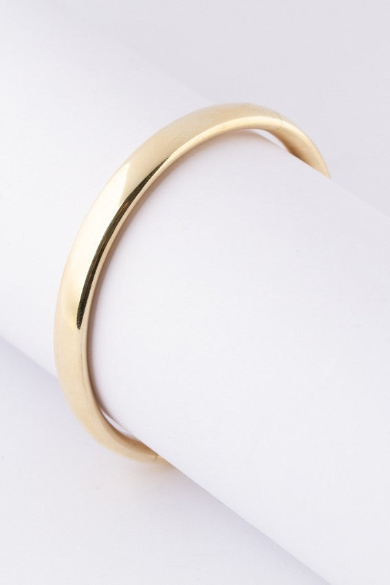Gold bangle with hinged closure