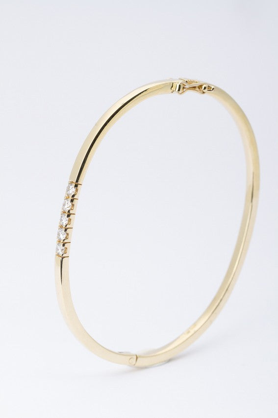 Gold bangle with 5 brilliant-cut diamonds (total approx. 0.50 ct.)