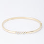 Gouden bangle met 5 briljanten (totaal ca. 0.50 ct.)