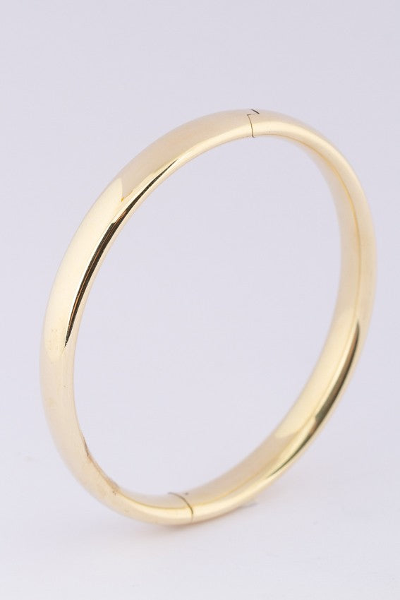 Gold bangle with hinge closure