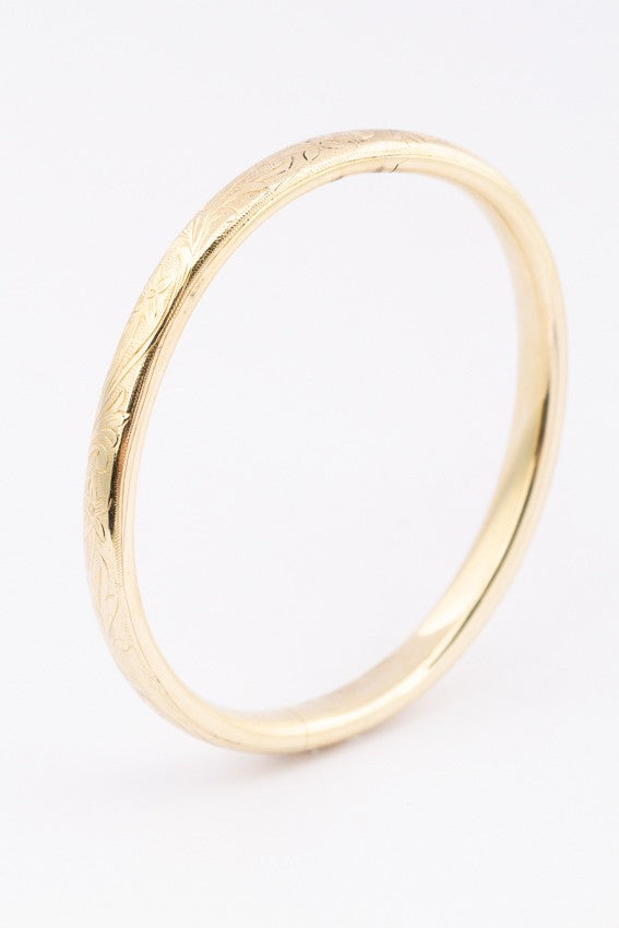 Gold bangle with hinged closure