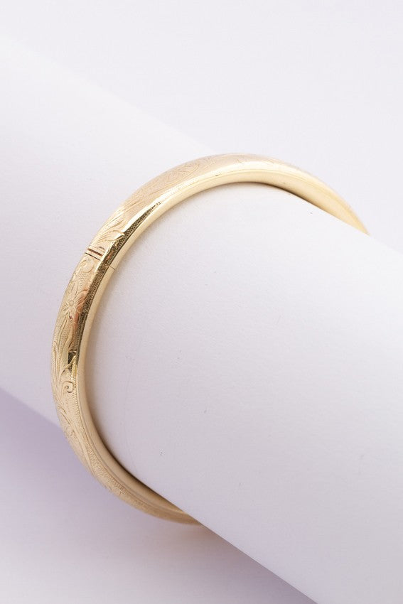 Gold bangle with hinged closure