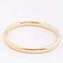 Gold bangle with hinged closure