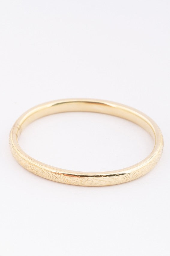 Gold bangle with hinged closure