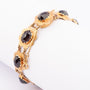 Gold bracelet with garnets