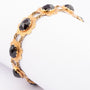 Gold bracelet with garnets