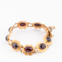 Gold bracelet with garnets