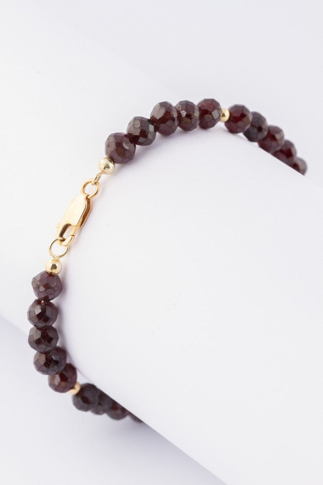 Granaat armband met gouden ballen.