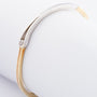 White/yellow gold bangle with a brilliant
