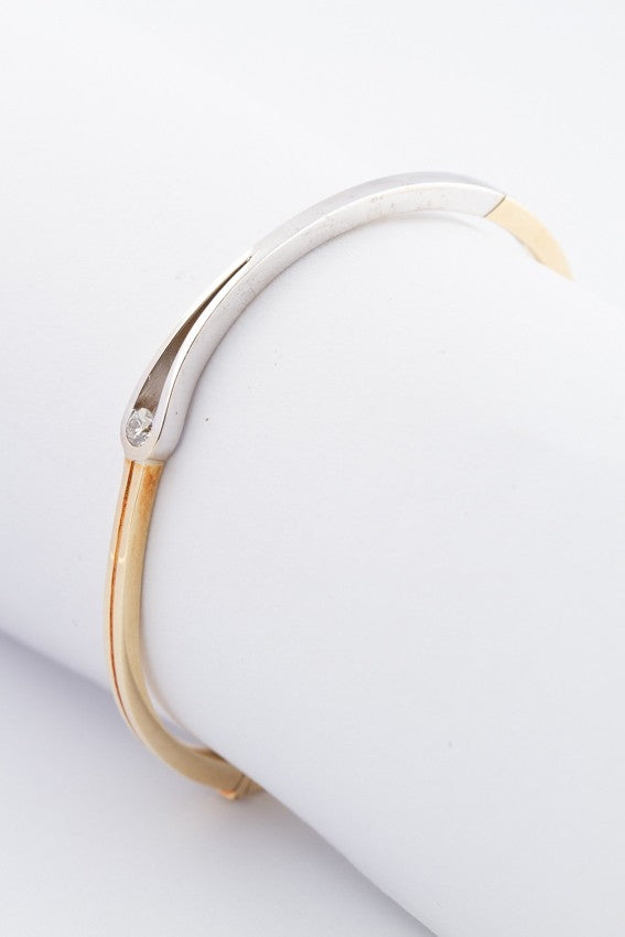 White/yellow gold bangle with a brilliant