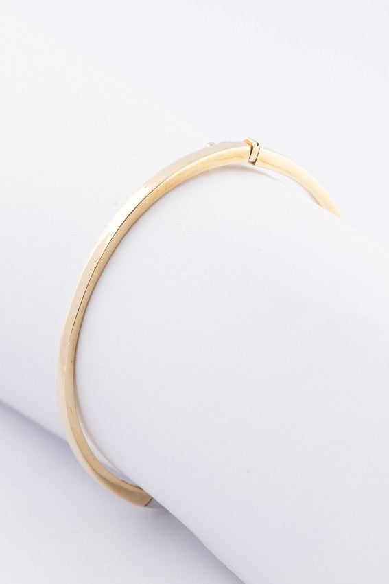 White/yellow gold bangle with a brilliant