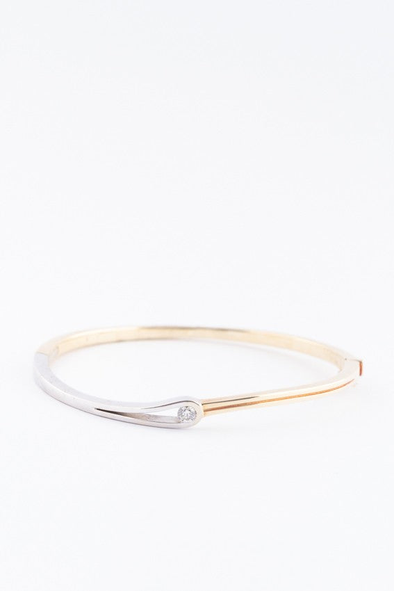 White/yellow gold bangle with a brilliant