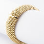 Golden braided bracelet.
