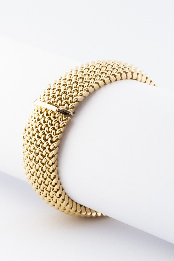 Golden braided bracelet.