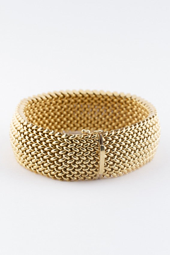 Golden braided bracelet.