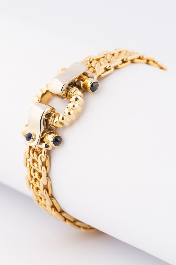 White/yellow gold bracelet with sapphires in the clasp