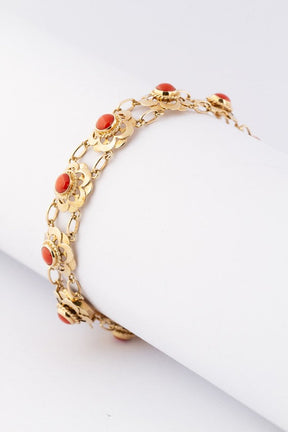 Gold link bracelet with blood corals