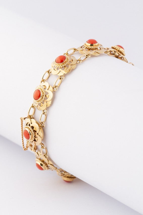 Gold link bracelet with blood corals
