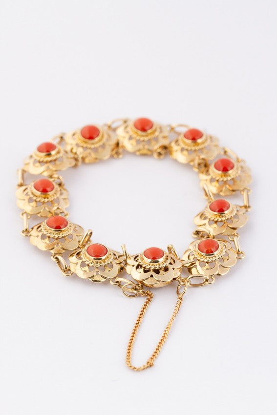 Gold link bracelet with blood corals