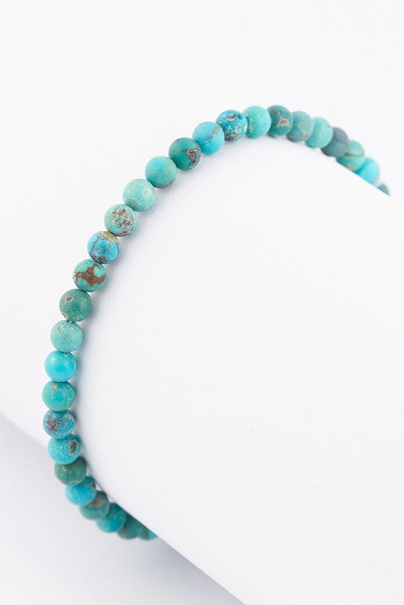 Turkoois armband aan gouden sluiting met granaat en turkoois