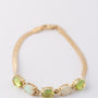 Gouden armband met opalen en peridoot