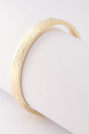 Gold bangle with hinged closure
