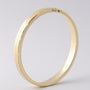 Gold bangle with hinged closure