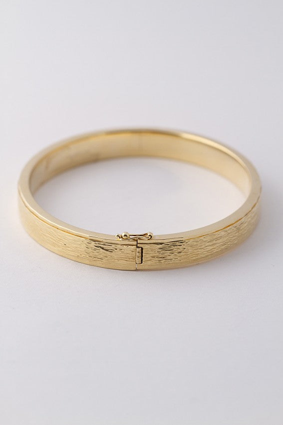 Gold bangle with hinged closure