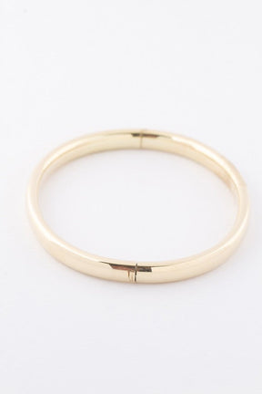 Gold bangle with hinge closure