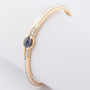 White/yellow gold bangle from the Le Chic brand with sapphire and diamonds
